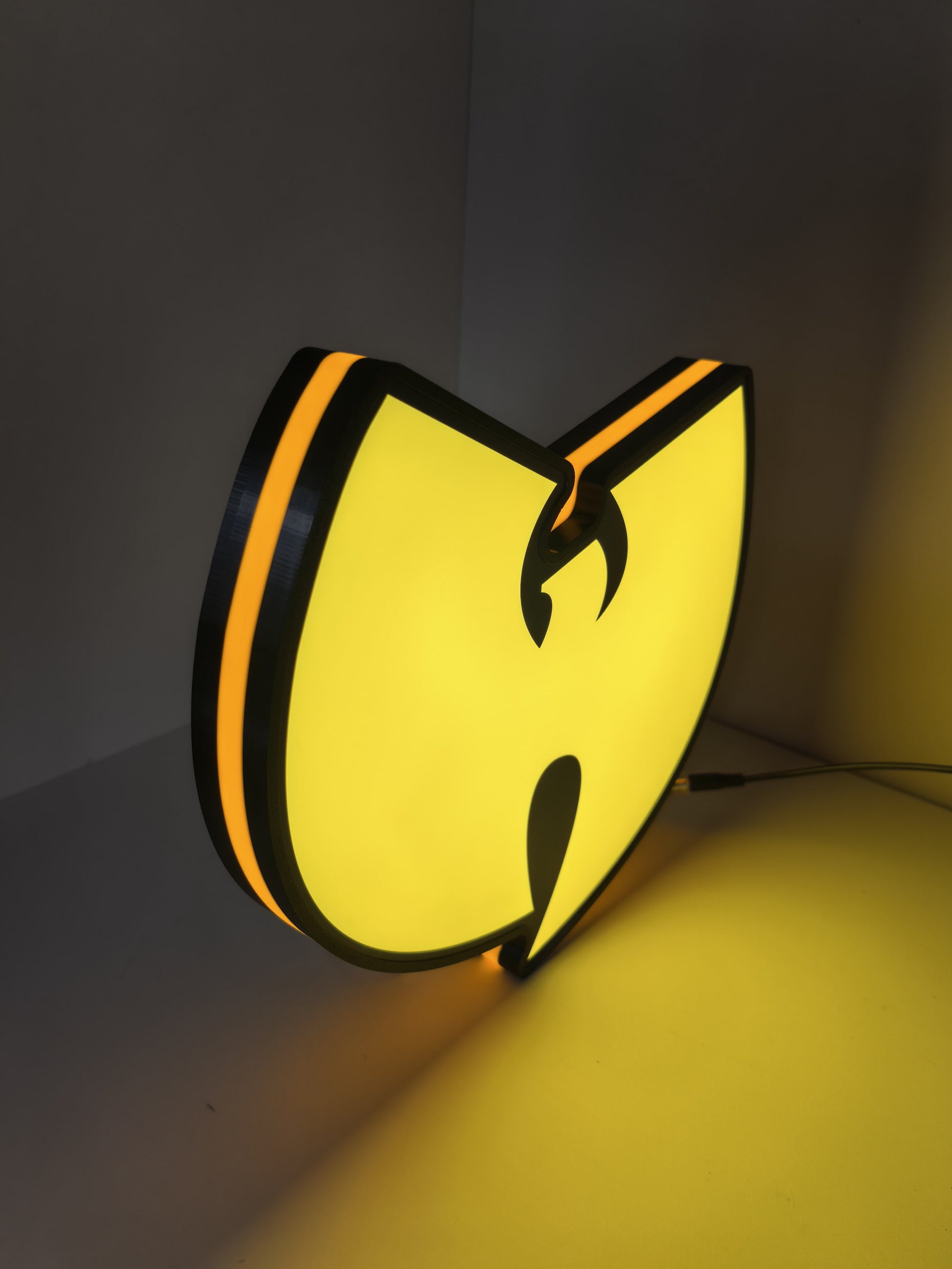Wu Tang LED Light Box (40cm) - Illuminated angled view standing, unique wall art for desk and room decor