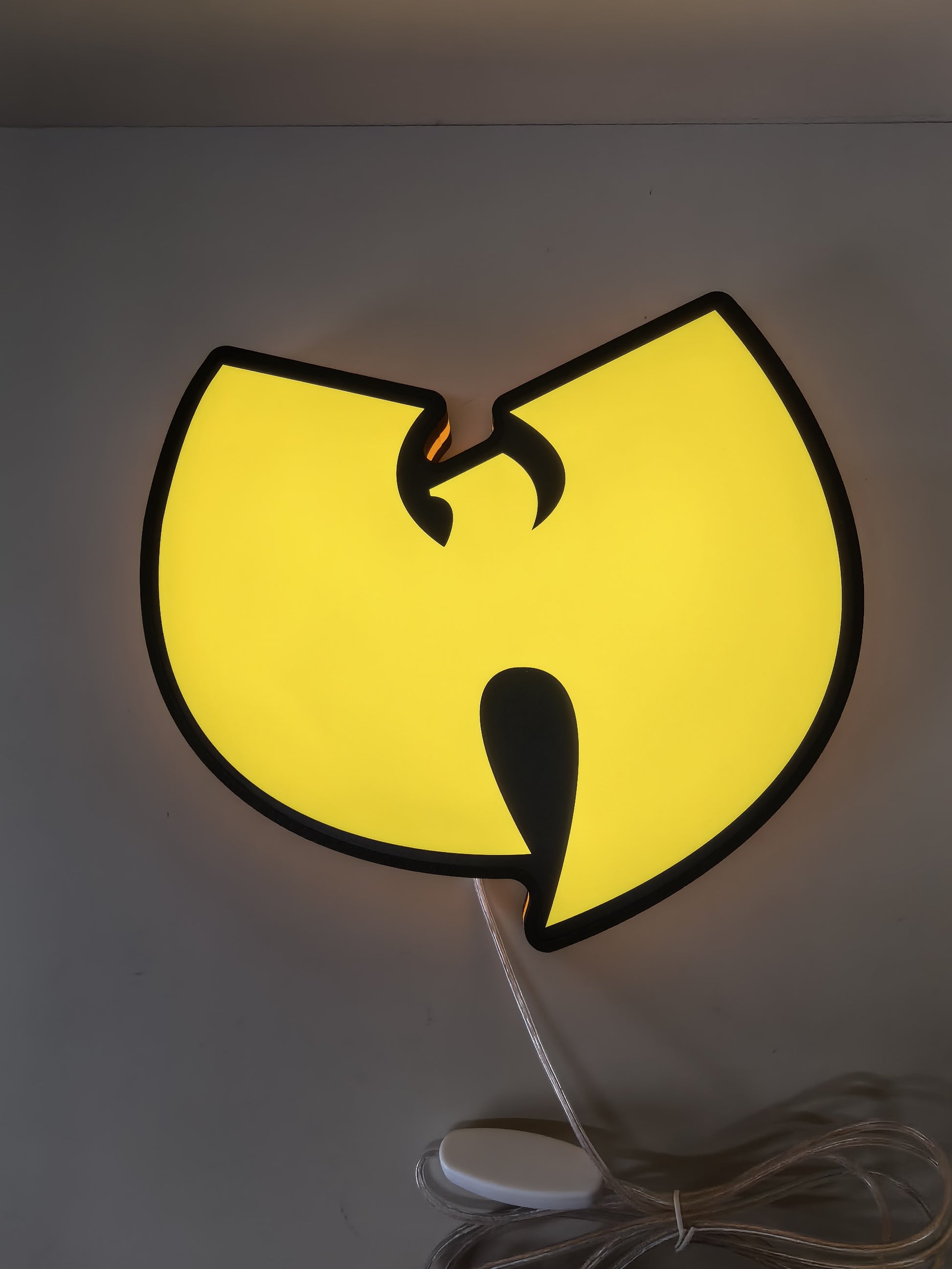 Illuminated flat lay front view of Wu Tang Illuminated Sign in 40cm, unique wall art for desk and room decor