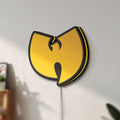 Unlit Wu Tang LED lightbox mounted on a wall in daylight