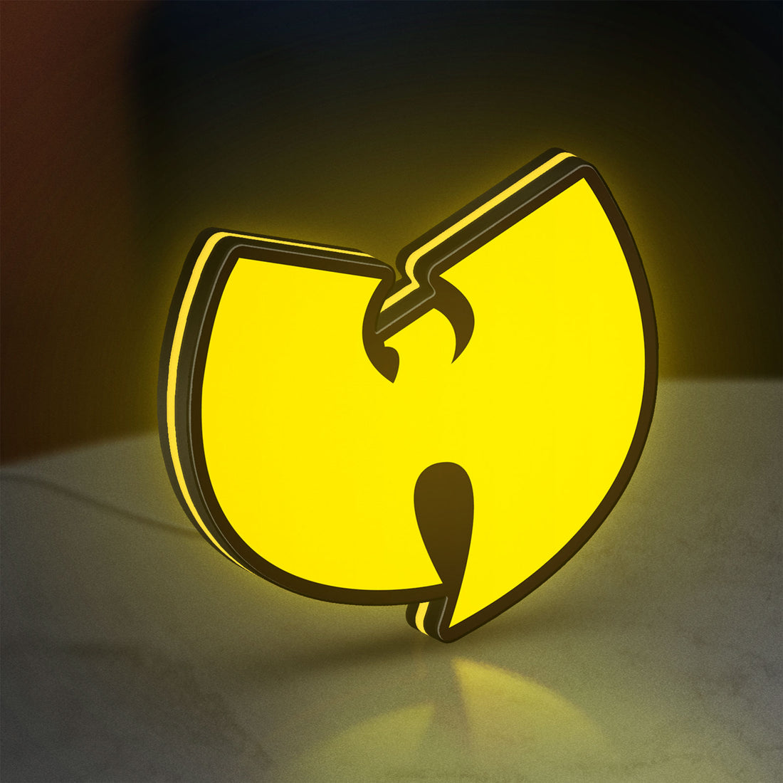 Wu Tang LED lightbox hanging on a wall with yellow glow