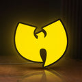 Front view of Wu Tang LED lightbox sign glowing on a wooden desk