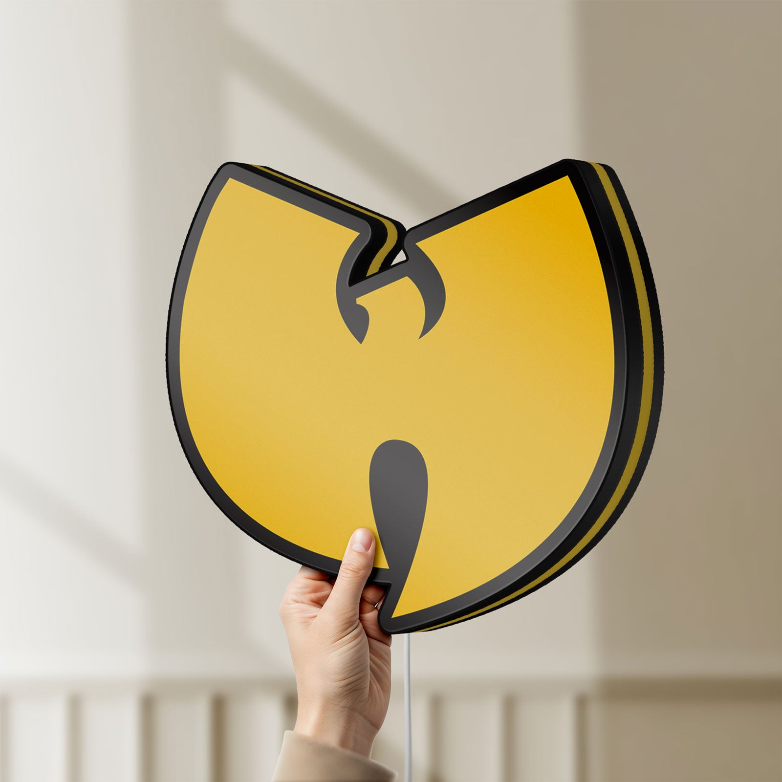 Unlit Wu Tang LED lightbox held by hand to show size and details