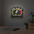 Bob Marley LED lightbox hanging on a room wall with soft white light