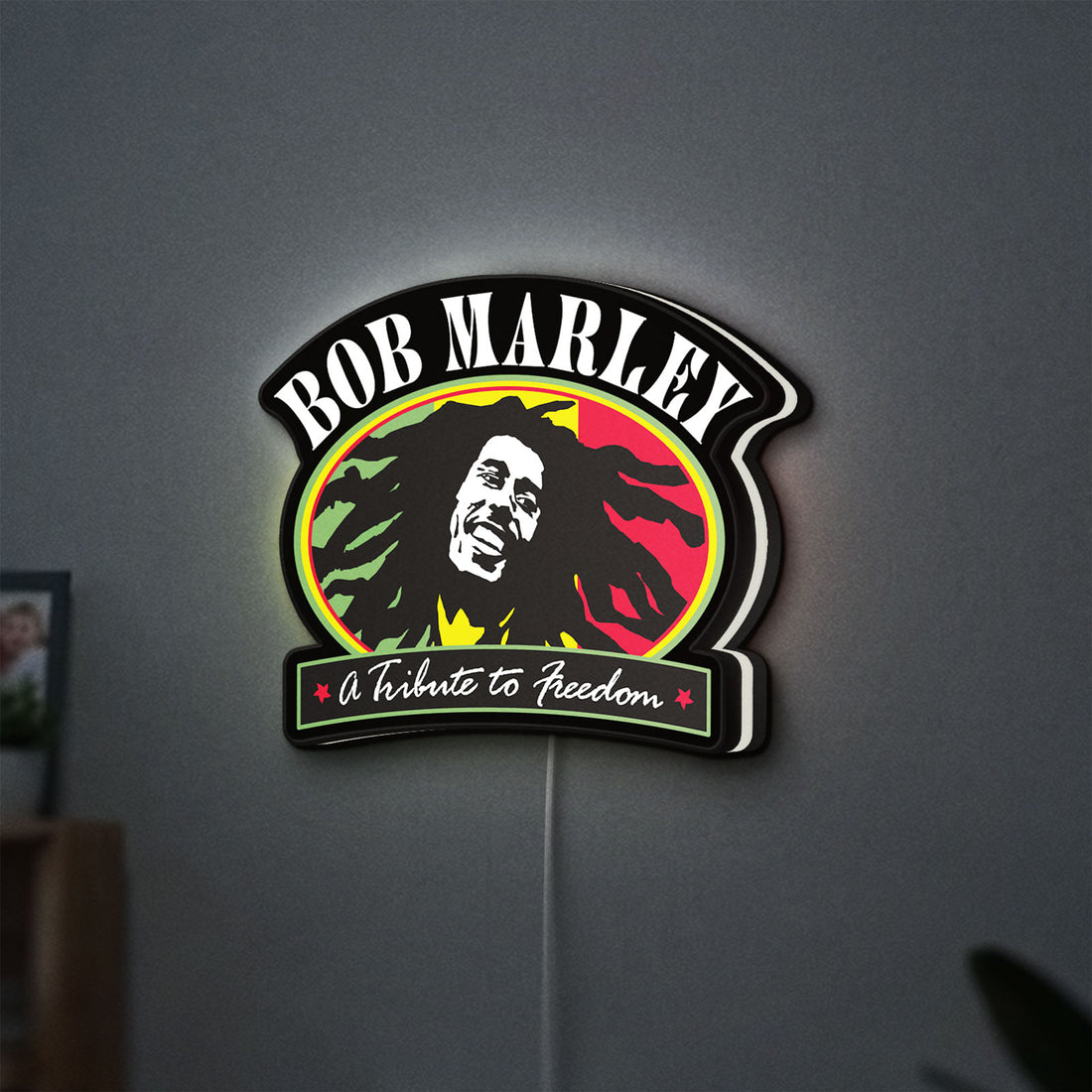 Bob Marley LED lightbox hanging on a wall with white glow