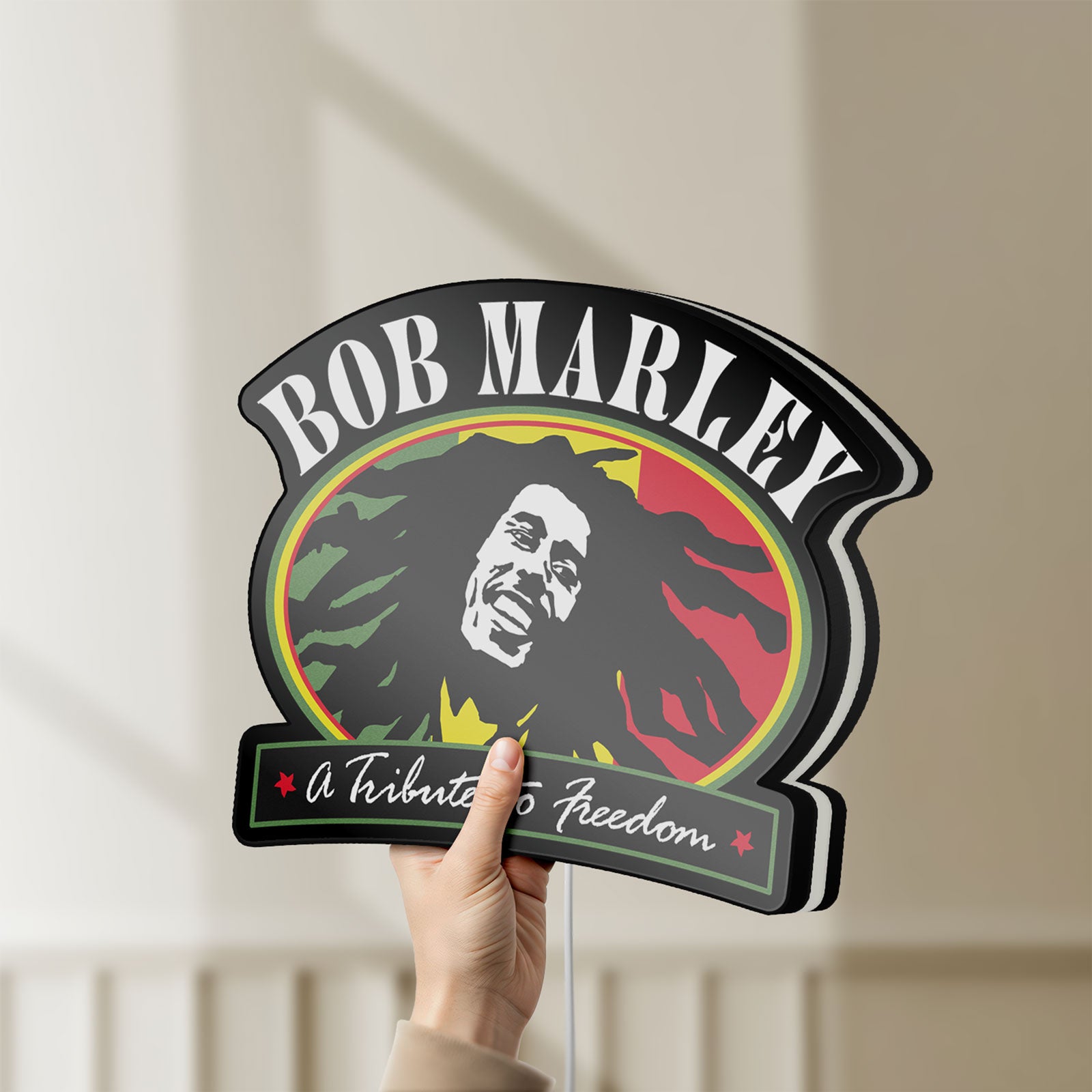 Unlit Bob Marley LED lightbox held by hand to show size and details