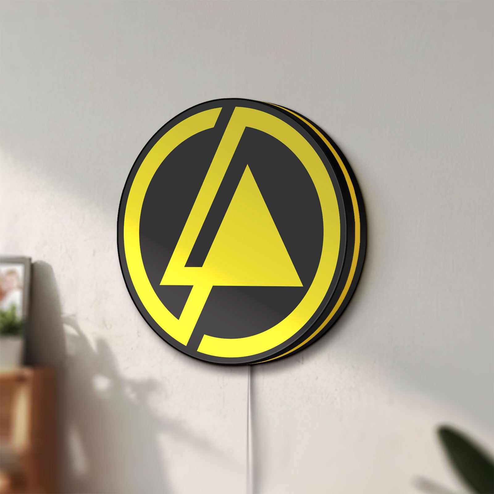 Unlit Linkin Park LED lightbox mounted on a wall in daylight