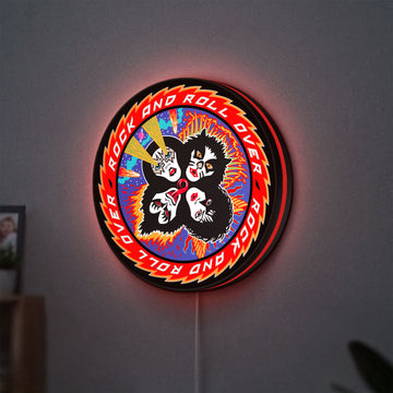 Kiss Rock And Roll Over LED lightbox hanging on a wall with red glow