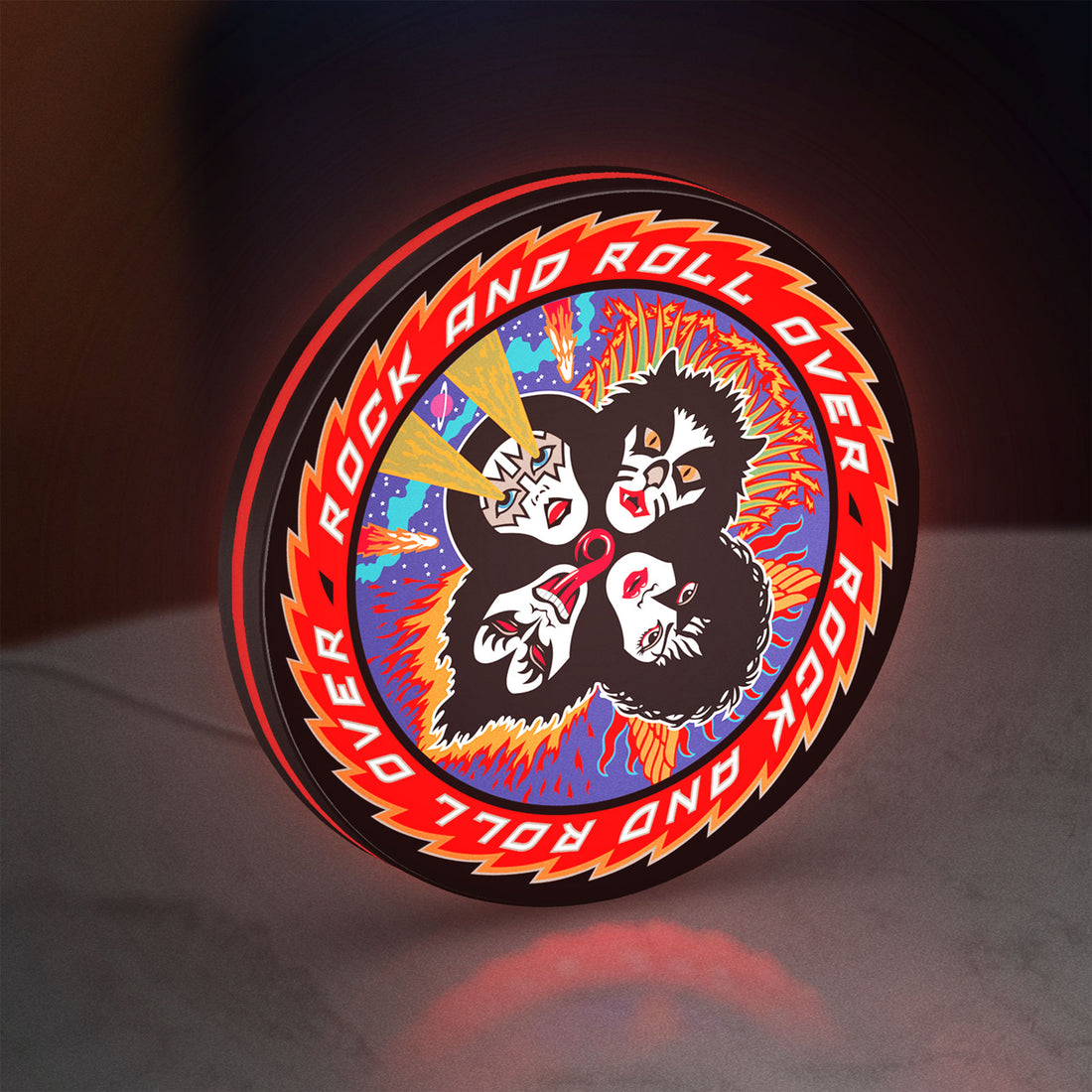 Kiss Rock And Roll Over LED lightbox hanging on a wall with red glow