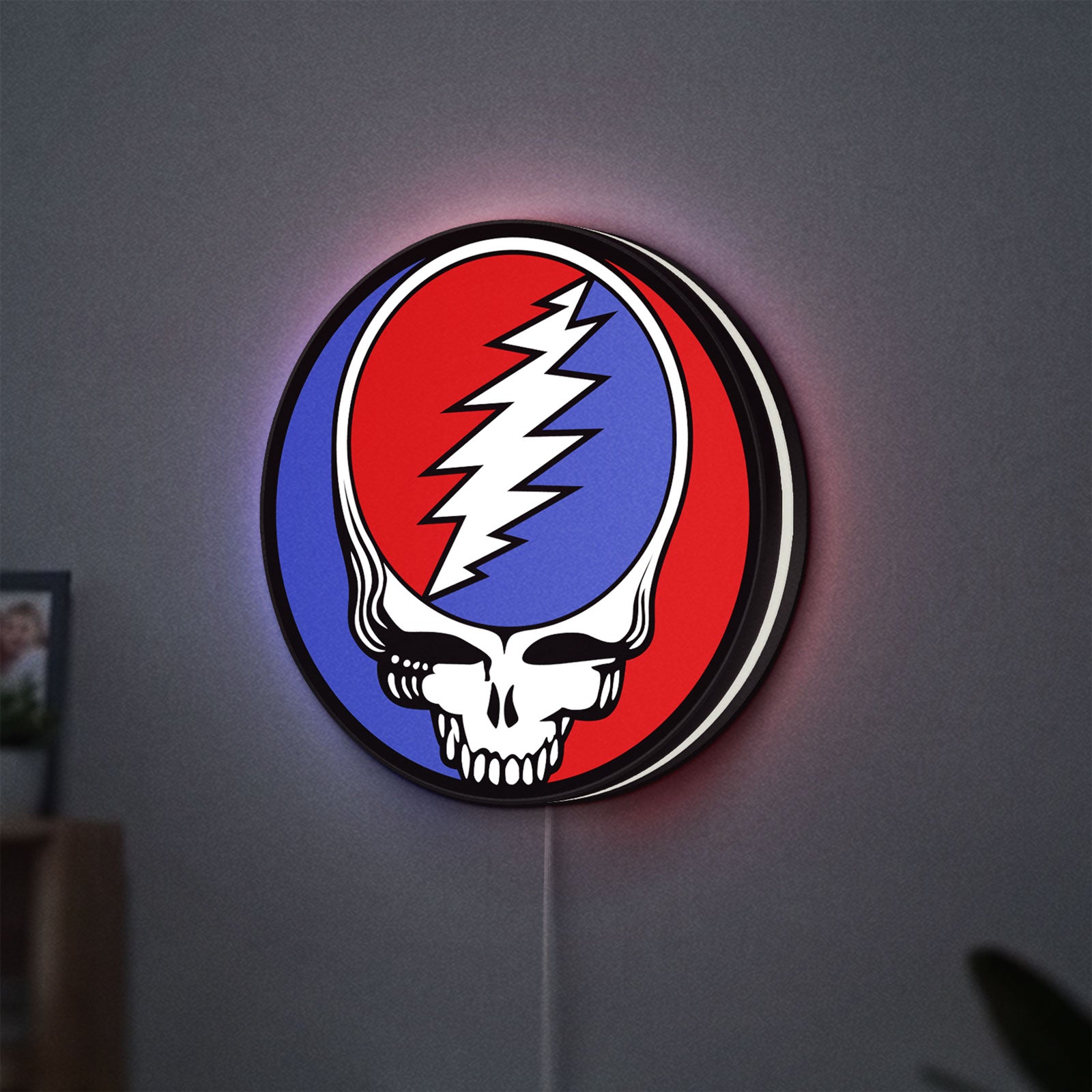 Grateful Dead LED lightbox hanging on a wall with white glow