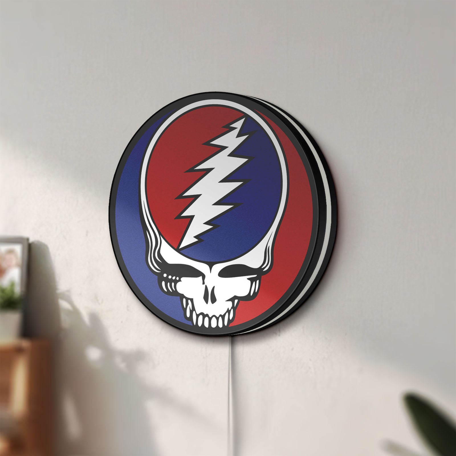 Unlit Grateful Dead LED lightbox mounted on a wall in daylight