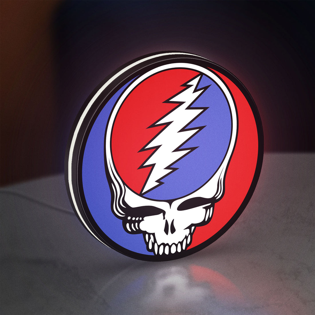 Grateful Dead LED lightbox hanging on a wall with white glow