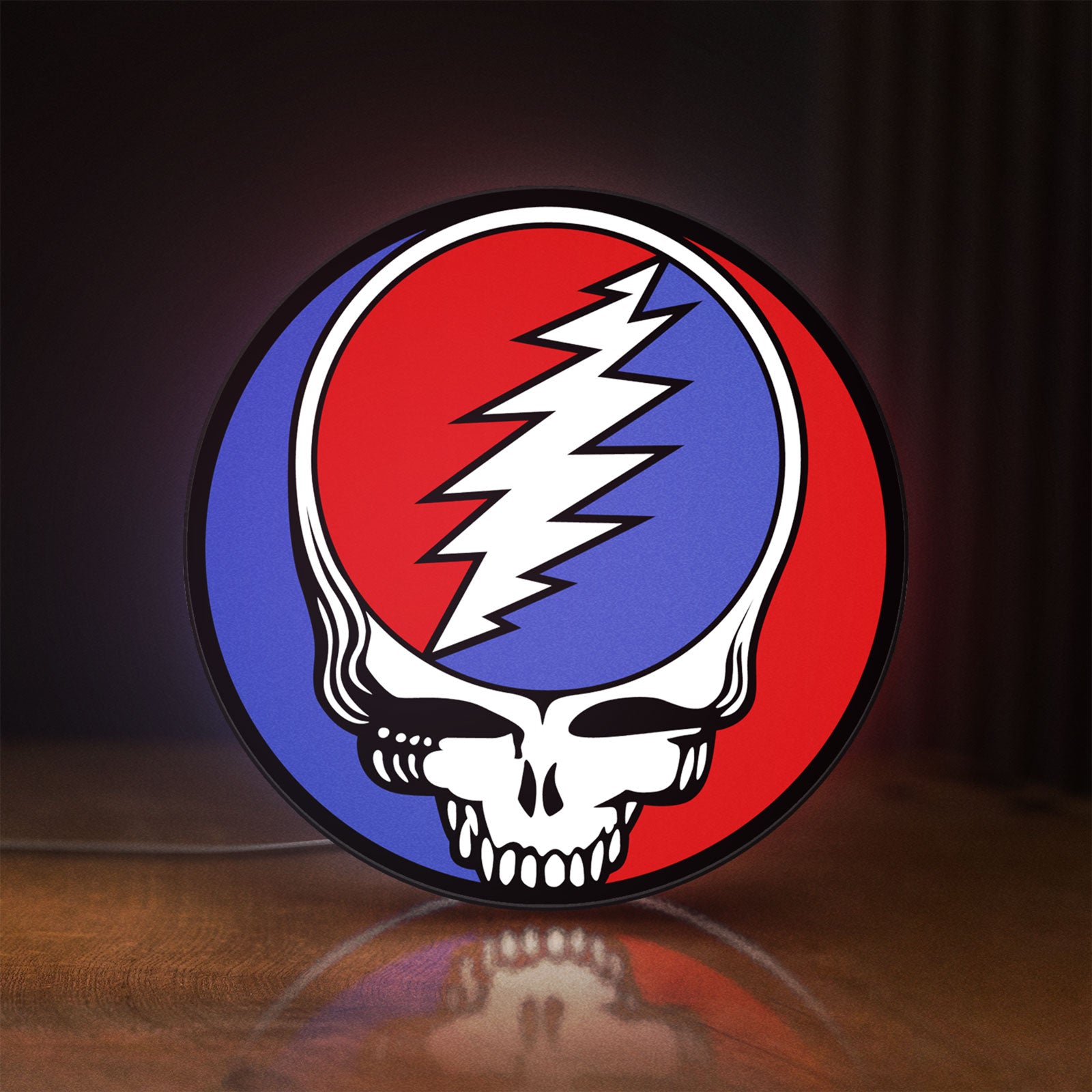 Front view of Grateful Dead LED lightbox sign glowing on a wooden desk