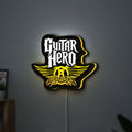 Aerosmith Guitar Hero LED lightbox hanging on a wall with yellow glow