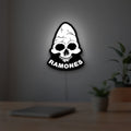 Ramones LED lightbox hanging on a room wall with soft white light