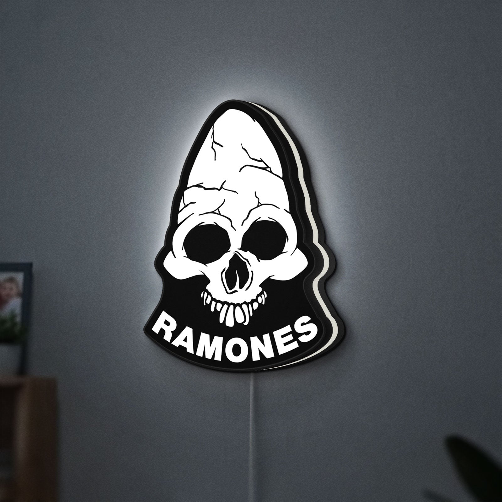 Ramones LED lightbox hanging on a wall with white glow