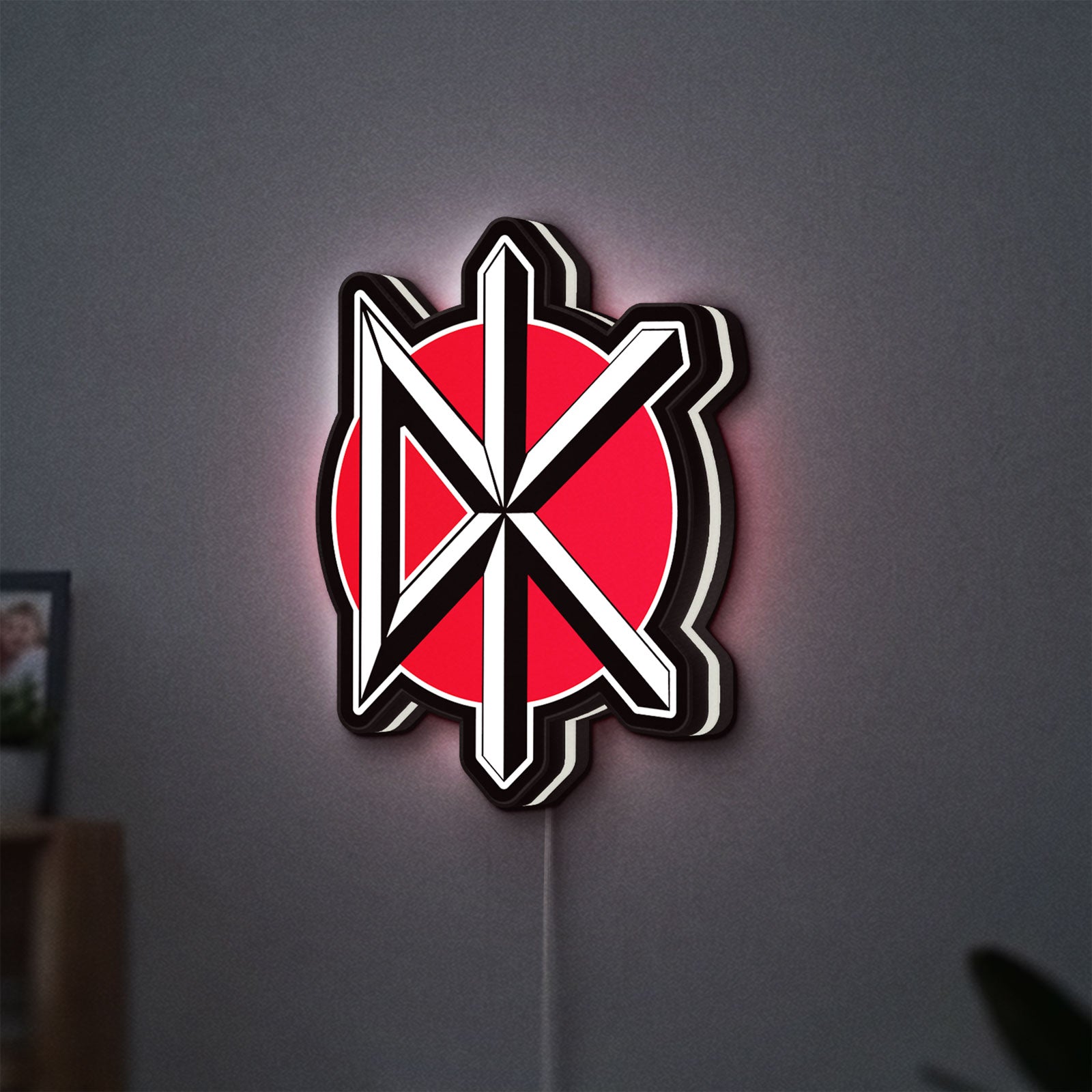 Dead Kennedys LED lightbox hanging on a wall with white glow