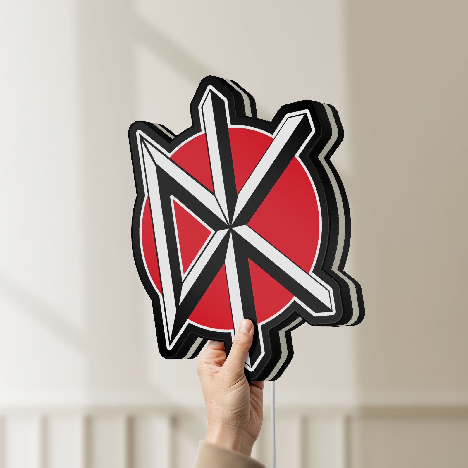 Unlit Dead Kennedys LED lightbox held by hand to show size and details