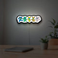 Grateful Dead Dancing Bears LED lightbox hanging on a room wall with soft white light