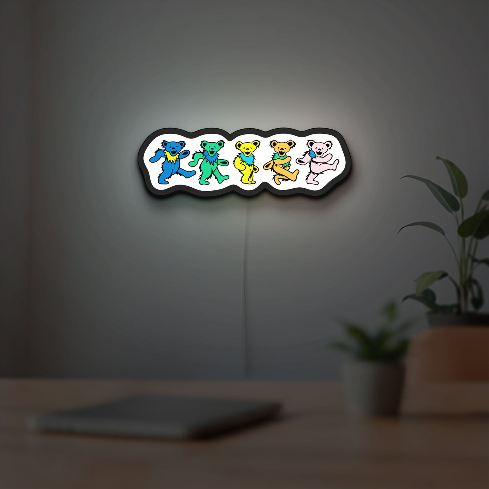 Grateful Dead Dancing Bears LED lightbox hanging on a room wall with soft white light