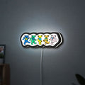 Grateful Dead Dancing Bears LED lightbox hanging on a wall with white glow