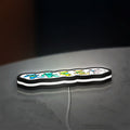 Grateful Dead Dancing Bears LED lightbox lying flat on a desk with white glow