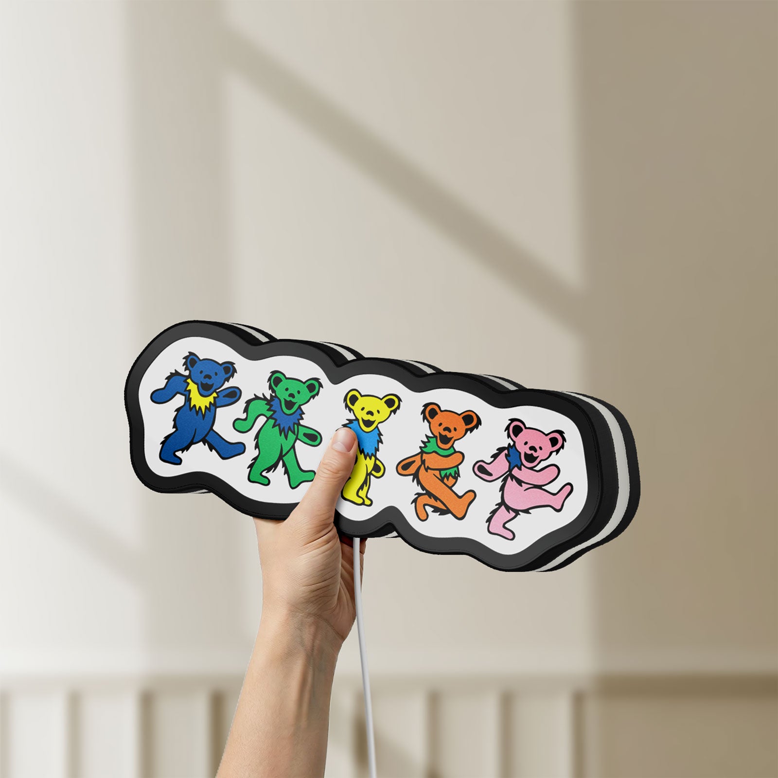 Unlit Grateful Dead Dancing Bears LED lightbox held by hand to show size and details