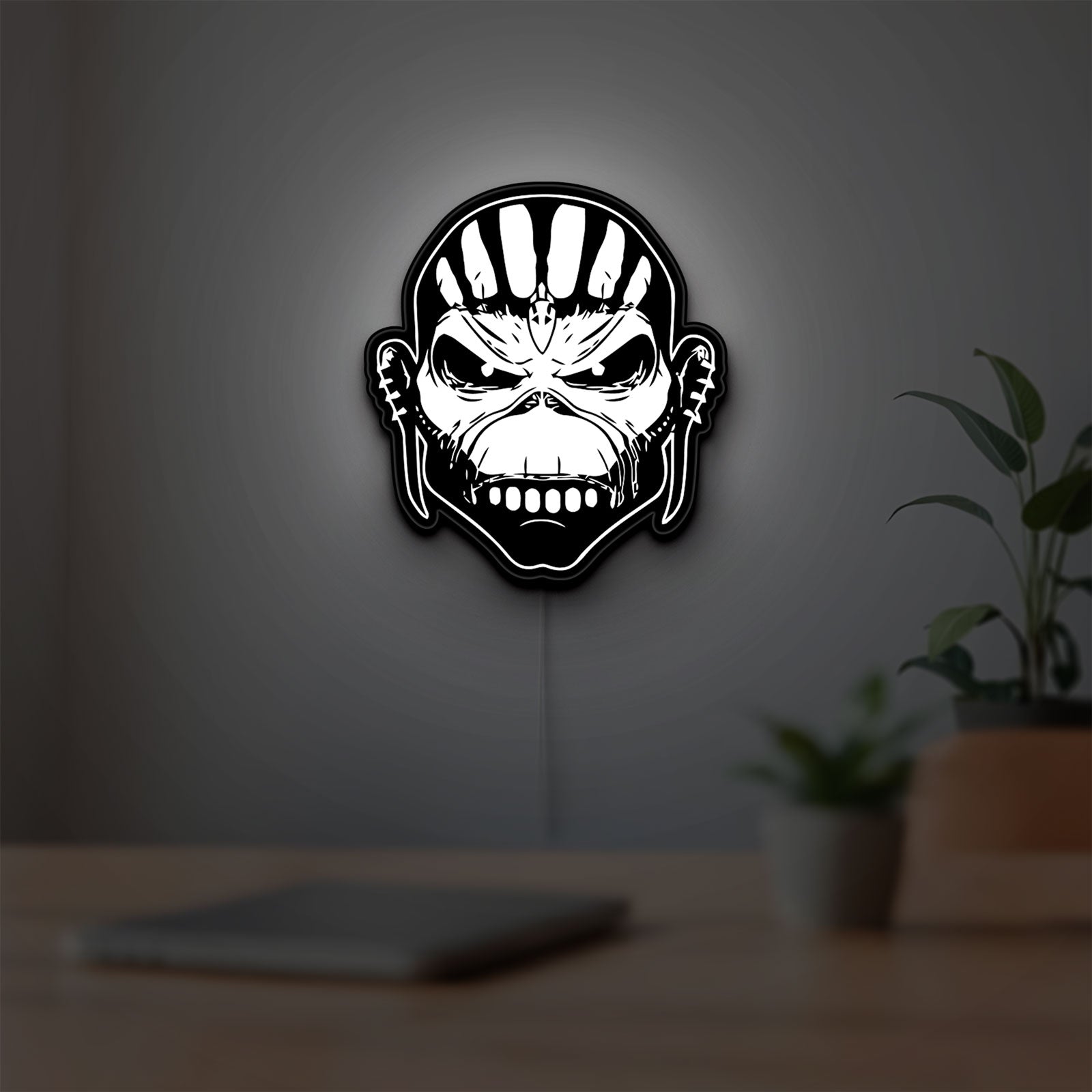Iron Maiden The Book Of Souls LED lightbox hanging on a room wall with soft white light