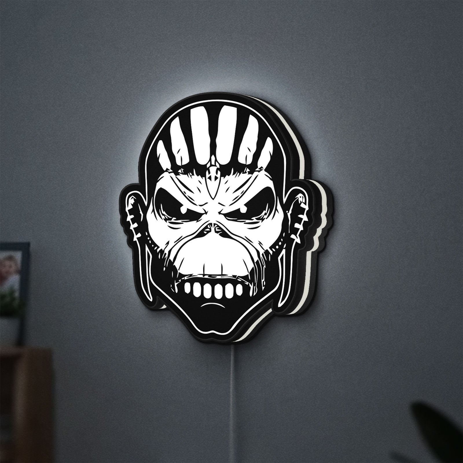 Iron Maiden The Book Of Souls LED lightbox hanging on a wall with white glow