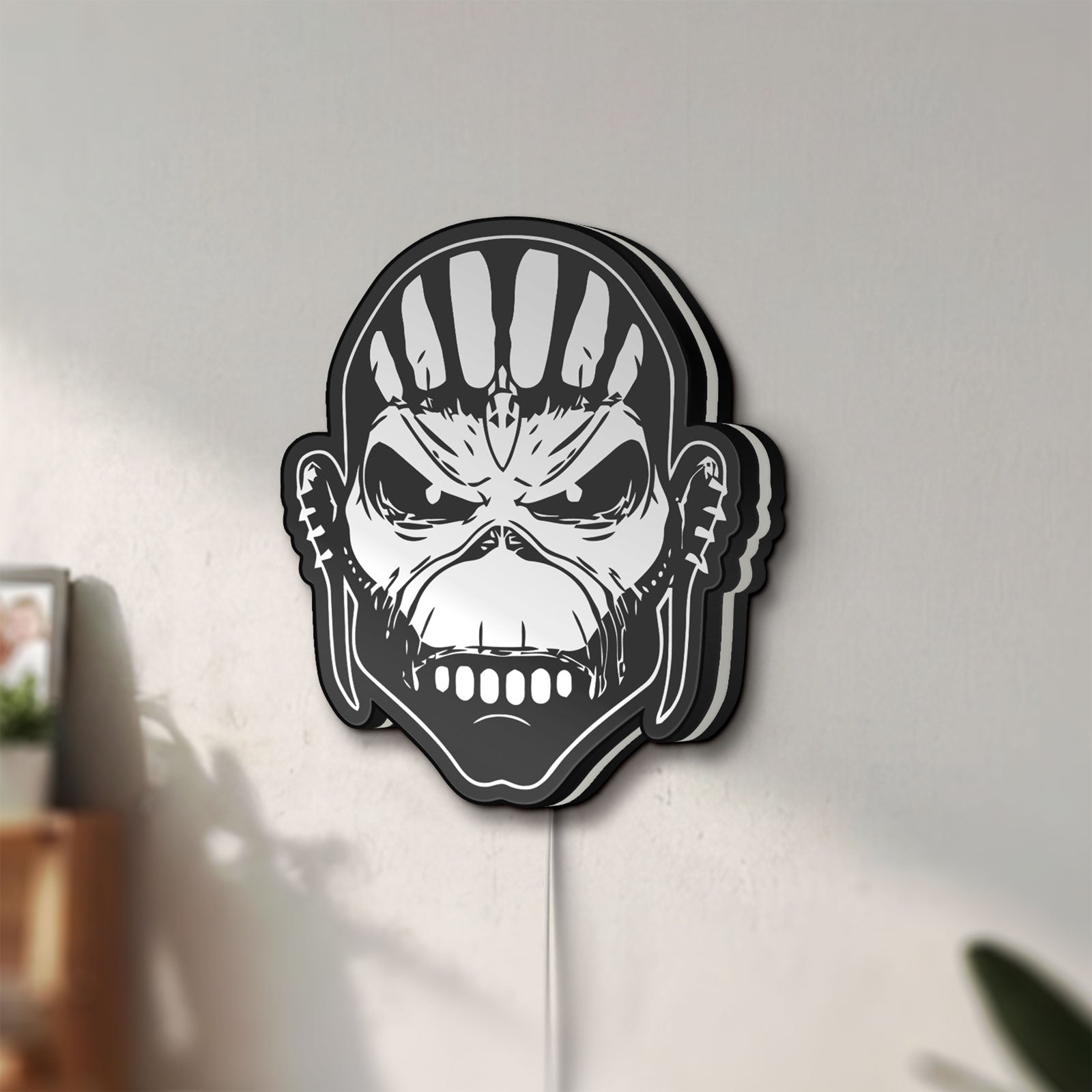 Unlit Iron Maiden The Book Of Souls LED lightbox mounted on a wall in daylight