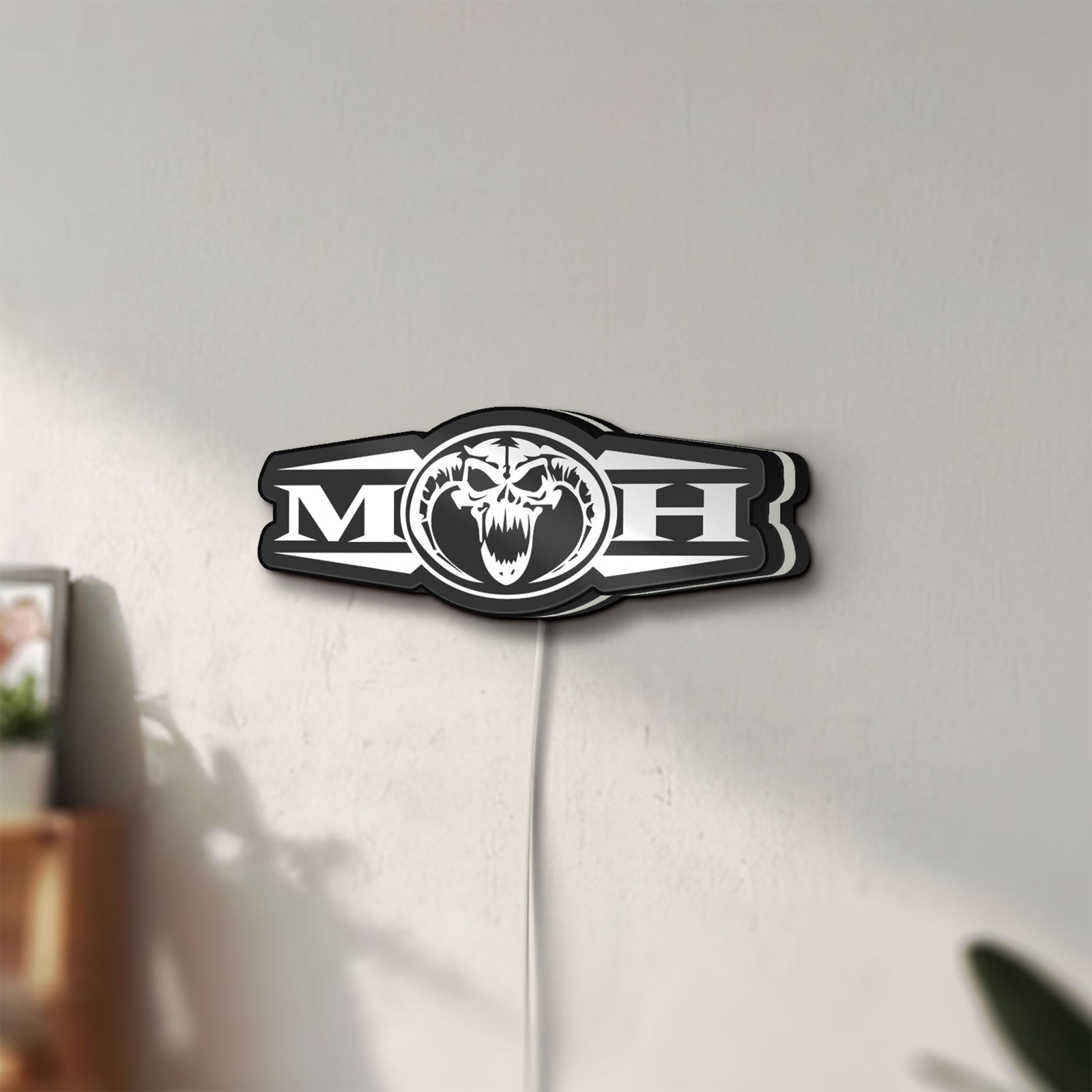 Unlit Masters Of Hardcore LED lightbox mounted on a wall in daylight