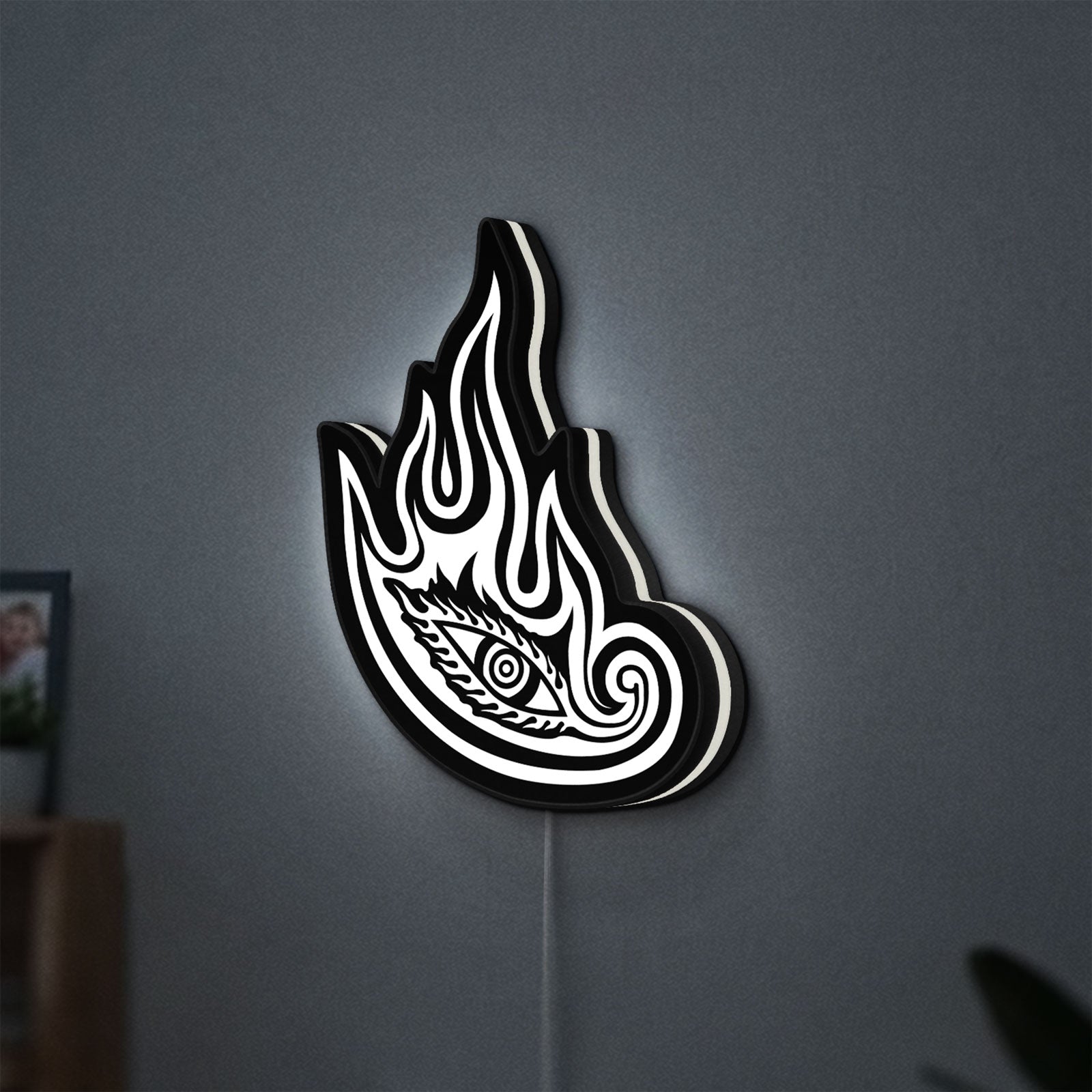 Tool Lateralus Eye LED lightbox hanging on a wall with white glow