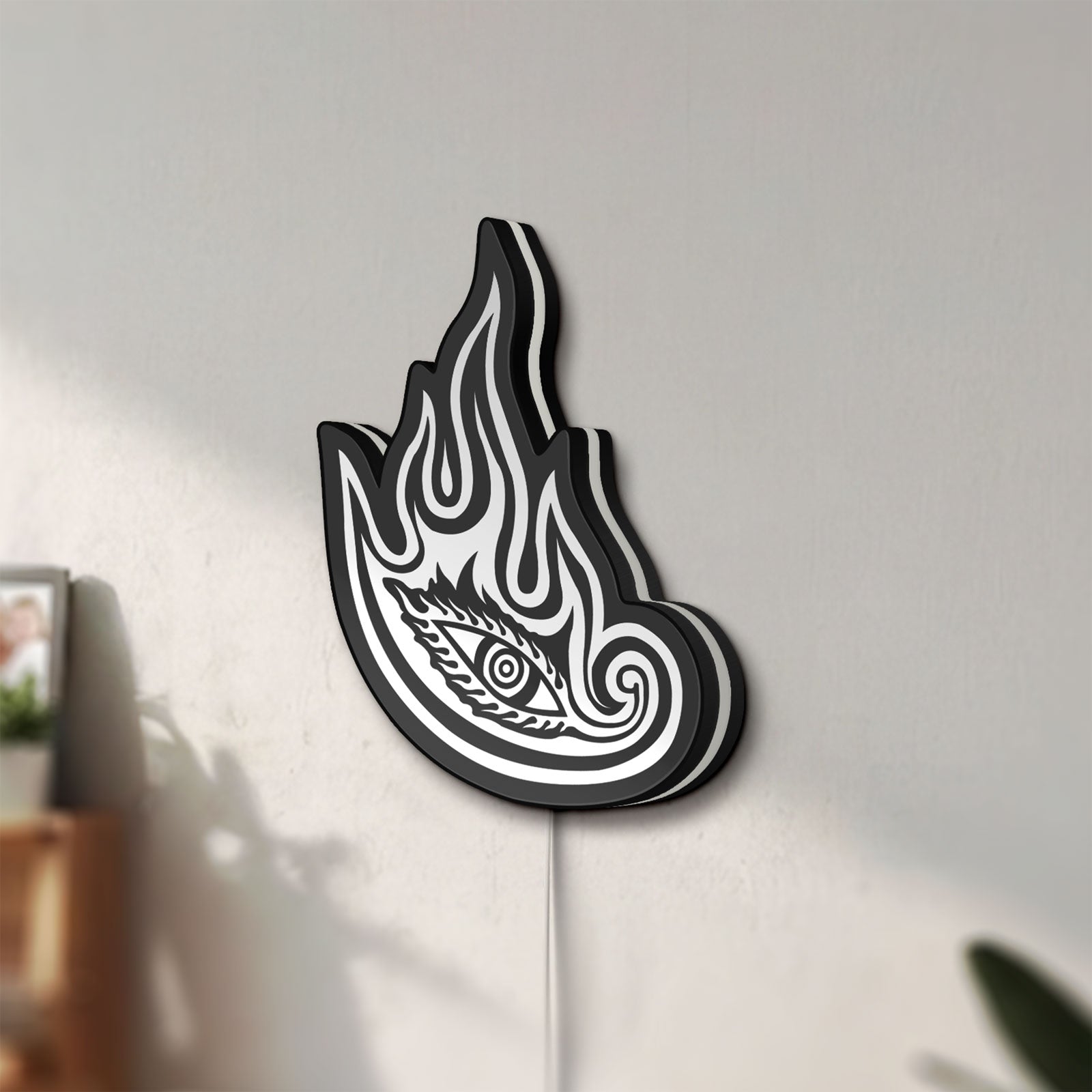 Unlit Tool Lateralus Eye LED lightbox mounted on a wall in daylight
