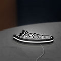Tool Lateralus Eye LED lightbox lying flat on a desk with white glow