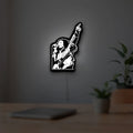 Bob Marley LED lightbox hanging on a room wall with soft white light