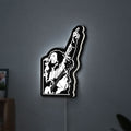 Bob Marley LED lightbox hanging on a wall with white glow