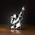 Front view of Bob Marley LED lightbox sign glowing on a wooden desk