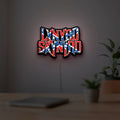 Lynyrd Skynyrd LED lightbox hanging on a room wall with soft red light