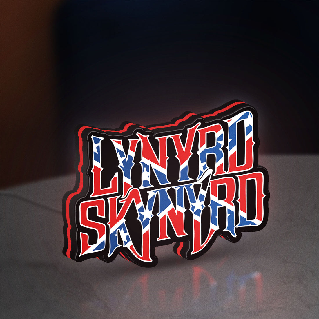 Lynyrd Skynyrd LED lightbox hanging on a wall with red glow