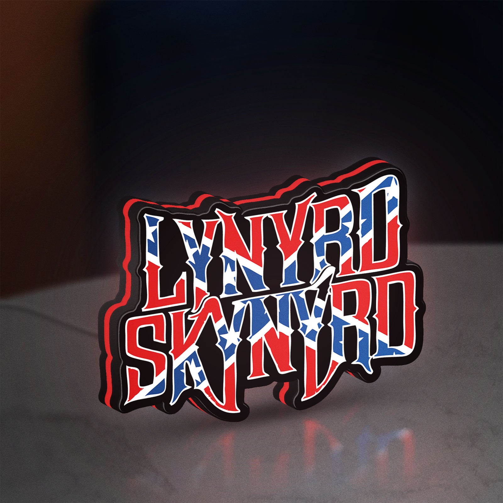 Lynyrd Skynyrd LED lightbox standing on a desk from an angled side view with red glow
