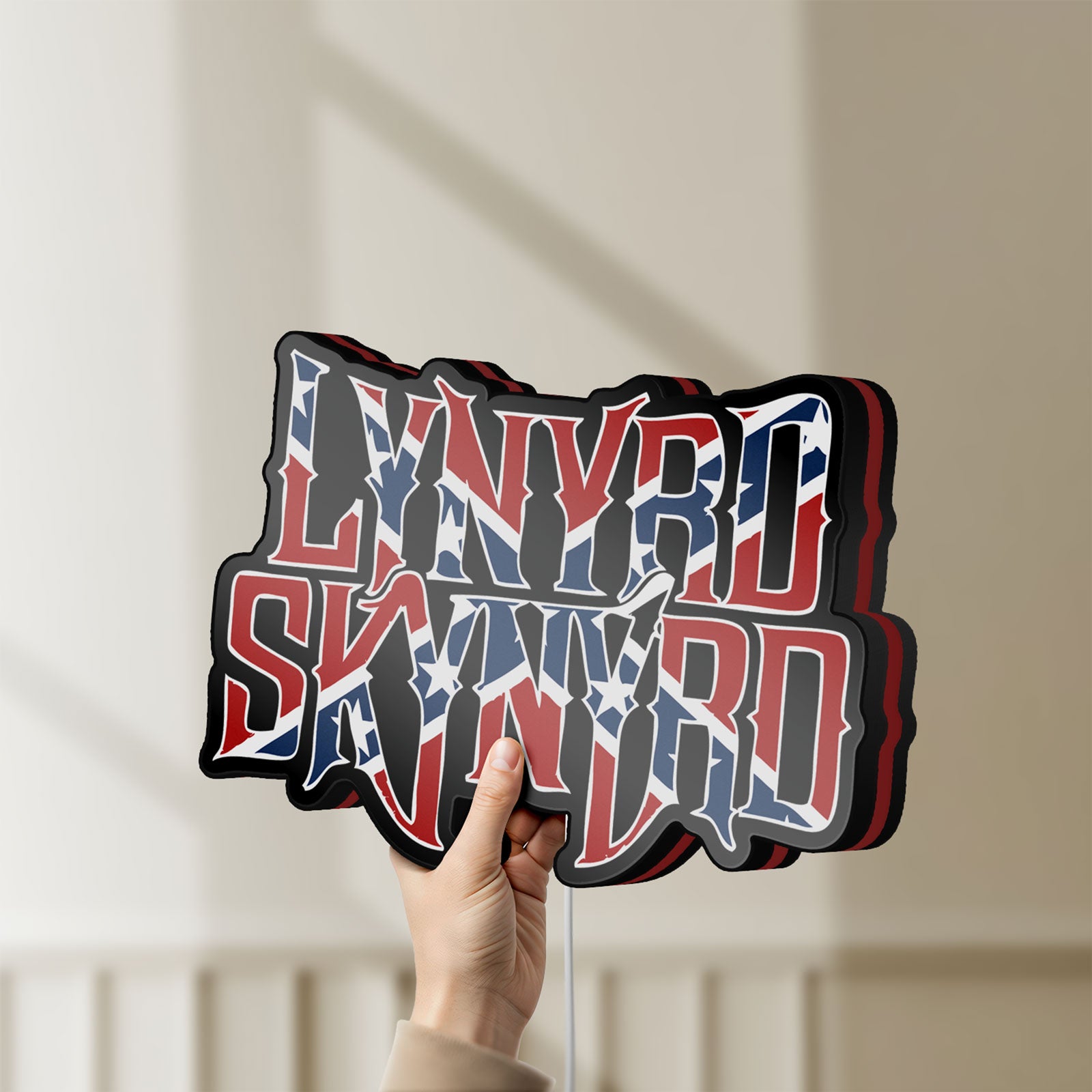Unlit Lynyrd Skynyrd LED lightbox held by hand to show size and details