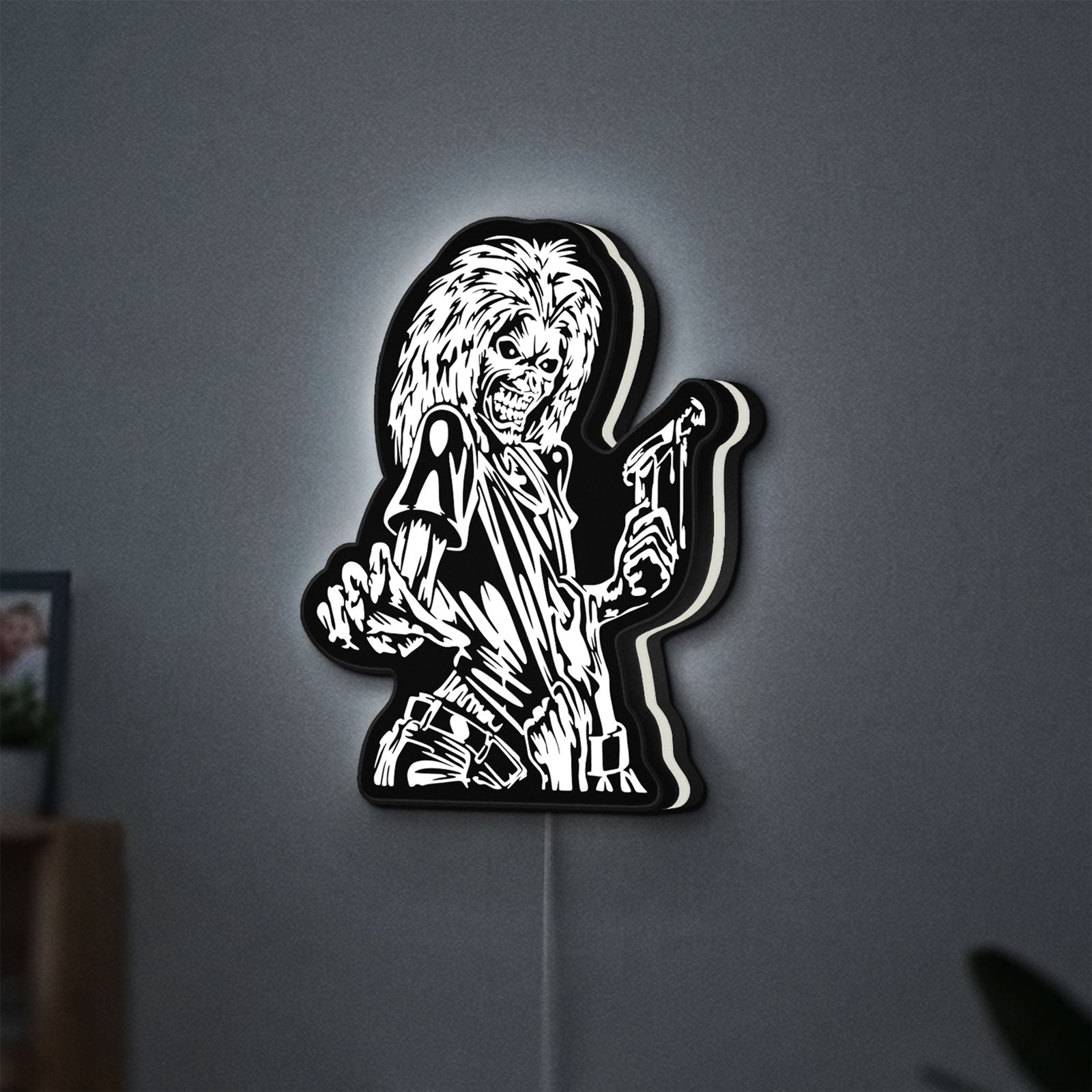 Iron Maiden Killers LED lightbox hanging on a wall with white glow