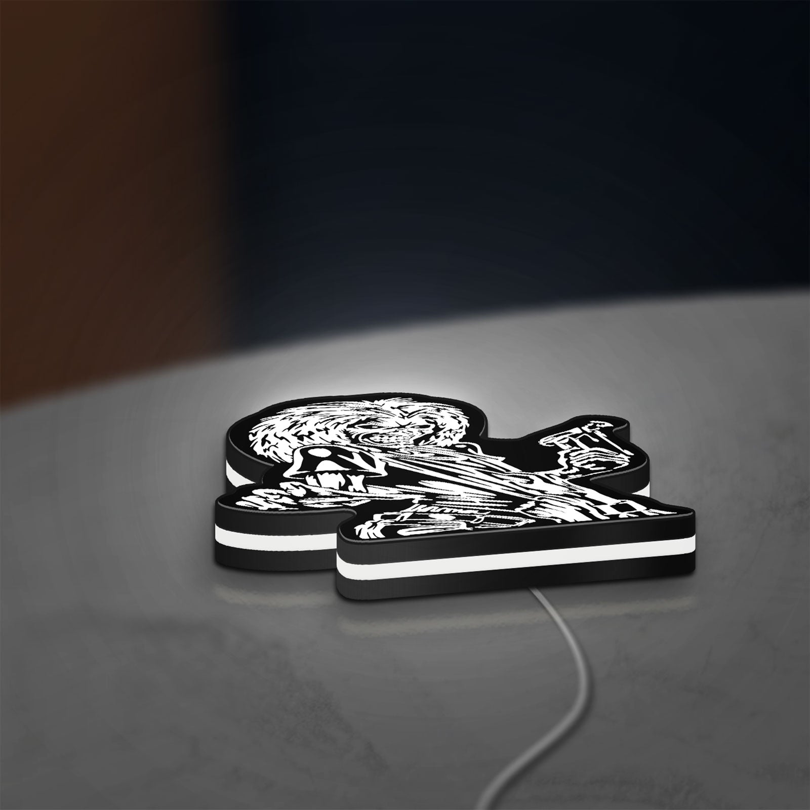 Iron Maiden Killers LED lightbox lying flat on a desk with white glow