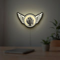 Kiss Army Fist LED lightbox hanging on a room wall with soft white light