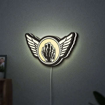 Kiss Army Fist LED lightbox hanging on a wall with white glow