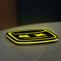Marshmello LED lightbox lying flat on a desk with yellow glow