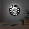 White Zombie Band LED lightbox hanging on a room wall with soft white light