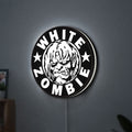 White Zombie Band LED lightbox hanging on a wall with white glow