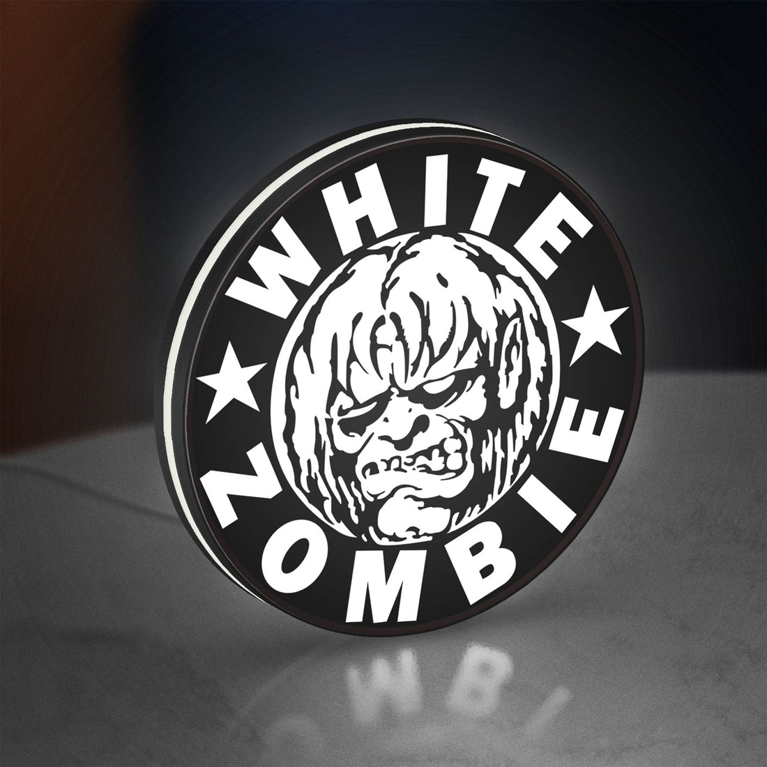 White Zombie Band LED lightbox hanging on a wall with white glow