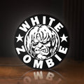 Front view of White Zombie Band LED lightbox sign glowing on a wooden desk