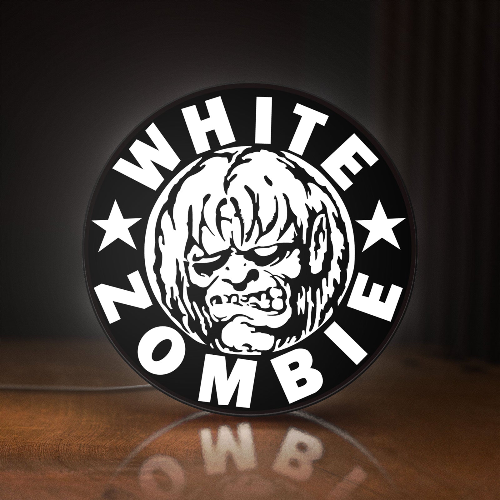 Front view of White Zombie Band LED lightbox sign glowing on a wooden desk